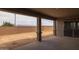 A covered patio overlooks a spacious backyard, offering an ideal space for outdoor relaxation and entertainment at 23036 E Oriole Way, Queen Creek, AZ 85142