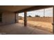 Covered patio with large columns and an open view of the backyard space, perfect for outdoor entertaining at 23036 E Oriole Way, Queen Creek, AZ 85142