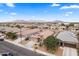 Aerial view of a residential area featuring neatly arranged homes and mountain views in the distance at 23690 W Ripple Rd, Buckeye, AZ 85326