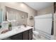 Well-lit bathroom featuring a white countertop vanity with a white shower curtain, and neutral walls at 23690 W Ripple Rd, Buckeye, AZ 85326