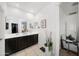 Bright bathroom with a double sink vanity, large mirror, and decorative accents, plus adjacent sitting room at 23690 W Ripple Rd, Buckeye, AZ 85326