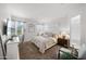 Bright main bedroom with a comfortable bed, soft lighting, and a tranquil ambiance for restful nights at 23690 W Ripple Rd, Buckeye, AZ 85326