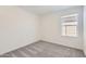 Cozy bedroom featuring carpeted floors, and a bright window at 25109 N 174Th Ln, Surprise, AZ 85387