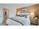 Comfortable main bedroom with soft lighting, plush bedding, and a relaxing atmosphere at 25109 N 174Th Ln, Surprise, AZ 85387