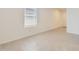 Bright bedroom features tile flooring, blinds, and neutral paint ready for customization at 25109 N 174Th Ln, Surprise, AZ 85387
