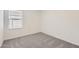 Bright bedroom featuring carpeted floors, and a bright window at 25109 N 174Th Ln, Surprise, AZ 85387