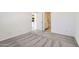 Bright bedroom with plush carpeting and ensuite bathroom featuring modern fixtures and finishes at 25109 N 174Th Ln, Surprise, AZ 85387