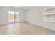 Bright bedroom featuring tile flooring and a sliding door at 25109 N 174Th Ln, Surprise, AZ 85387