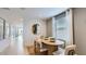 Cozy dining area with an oval table, four chairs, and a window letting in natural light at 25109 N 174Th Ln, Surprise, AZ 85387