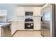 Bright kitchen features stainless steel appliances and white cabinetry with modern finishes at 25109 N 174Th Ln, Surprise, AZ 85387