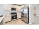 Modern kitchen with stainless steel appliances, white cabinets, and ample counter space at 25109 N 174Th Ln, Surprise, AZ 85387