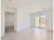 Spacious living room with tile floors and sliding glass door to backyard patio at 25109 N 174Th Ln, Surprise, AZ 85387