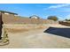 Home exterior featuring a spacious backyard and tall block wall at 29402 W Mitchell Ave, Buckeye, AZ 85396