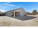 Home exterior featuring a covered patio and spacious backyard at 29402 W Mitchell Ave, Buckeye, AZ 85396