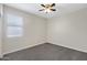 Bedroom with neutral walls, carpeted floors, a ceiling fan, and natural light at 29402 W Mitchell Ave, Buckeye, AZ 85396