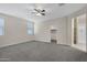 Large main bedroom with neutral walls, carpeted floors, and ensuite access at 29402 W Mitchell Ave, Buckeye, AZ 85396