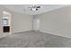 Open main bedroom with neutral walls, carpeted floors, and ensuite access at 29402 W Mitchell Ave, Buckeye, AZ 85396