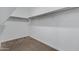 Walk-in closet with carpeted floors and built-in shelving units at 29402 W Mitchell Ave, Buckeye, AZ 85396