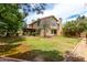View of the house from the backyard, featuring a balcony and patio at 3337 E Glade Cir, Mesa, AZ 85204