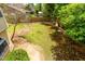Backyard with grass, plants, trees and a view of a cabana, perfect for relaxation and recreation at 3337 E Glade Cir, Mesa, AZ 85204