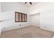 Bright bedroom with vaulted ceiling, neutral color, and a window with wood blinds at 3337 E Glade Cir, Mesa, AZ 85204