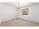 Empty bedroom with neutral-colored walls and carpet at 3337 E Glade Cir, Mesa, AZ 85204