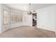 Dining room featuring updated windows, neutral carpet and a view into the kitchen at 3337 E Glade Cir, Mesa, AZ 85204
