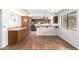 Bright kitchen with breakfast bar, tile countertops, wood cabinets, and stainless steel appliances at 3337 E Glade Cir, Mesa, AZ 85204