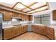 Kitchen with stainless steel appliances, wood cabinets, and tile backsplash at 3337 E Glade Cir, Mesa, AZ 85204