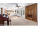 Open floor plan living room with backyard access, wood floors and a kitchen pass through at 3337 E Glade Cir, Mesa, AZ 85204