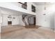 Open floor plan with high ceilings, living area, staircase and views to upper level at 3337 E Glade Cir, Mesa, AZ 85204