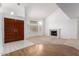 Spacious living room with vaulted ceilings, fireplace, wood flooring and updated windows at 3337 E Glade Cir, Mesa, AZ 85204
