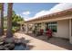 Enjoy the outdoor kitchen, seating, and lush landscaping on this open back patio with beautiful water feature at 3441 N 162Nd Ln, Goodyear, AZ 85395