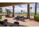Relax on the back patio with water feature overlooking the golf course and serene lake views at 3441 N 162Nd Ln, Goodyear, AZ 85395