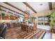 Dining room with vaulted ceilings, beam accents and large windows create a bright and airy space for entertaining guests at 3441 N 162Nd Ln, Goodyear, AZ 85395