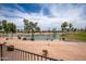 Scenic view of a golf course and a pond under a blue sky with fluffy clouds at 3441 N 162Nd Ln, Goodyear, AZ 85395