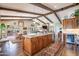 Open kitchen with a granite island and stainless steel appliances overlooking the living area at 3441 N 162Nd Ln, Goodyear, AZ 85395