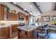 Kitchen featuring custom cabinetry, granite countertops, and stainless steel appliances at 3441 N 162Nd Ln, Goodyear, AZ 85395