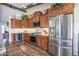 Modern kitchen featuring stainless steel appliances, custom cabinets, and granite countertops at 3441 N 162Nd Ln, Goodyear, AZ 85395