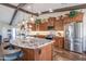 Bright kitchen boasts stainless steel appliances, granite counters, and ample cabinet space at 3441 N 162Nd Ln, Goodyear, AZ 85395