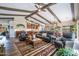 Spacious living room with an open layout, exposed beams, and comfortable seating at 3441 N 162Nd Ln, Goodyear, AZ 85395