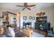 Living room showcasing a leather couch, patterned rug, and a stylish media center with desk area at 3441 N 162Nd Ln, Goodyear, AZ 85395
