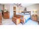 Well-lit main bedroom features wood furniture and decor, offering a cozy and inviting space for rest and relaxation at 3441 N 162Nd Ln, Goodyear, AZ 85395