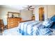 Bright main bedroom with wooden furnishings and decor creates a warm and inviting space for relaxation and rest at 3441 N 162Nd Ln, Goodyear, AZ 85395