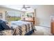 Bright main bedroom with a ceiling fan and views of the golf course provides a relaxing and comfortable atmosphere at 3441 N 162Nd Ln, Goodyear, AZ 85395