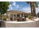 Spacious outdoor patio featuring a dining area, bar, and lush landscaping for serene outdoor living at 3441 N 162Nd Ln, Goodyear, AZ 85395