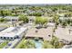 Aerial view of a home with a pool and patio area, surrounded by lush greenery and neighborhood views at 402 E Claremont St, Phoenix, AZ 85012