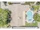 Aerial view of a home with a tile roof and a sparkling swimming pool in the backyard at 402 E Claremont St, Phoenix, AZ 85012