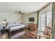 Cozy bedroom features hardwood floors and a sliding door to the outdoor space at 402 E Claremont St, Phoenix, AZ 85012