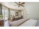 Bright and airy bedroom with hardwood floors and views of the backyard at 402 E Claremont St, Phoenix, AZ 85012